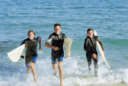 Three People with Surf Boards